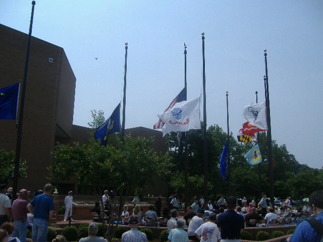 The colors are lowered to half-staff. Custom dictates that on Memorial Day the flag be at half-staff until noon. 