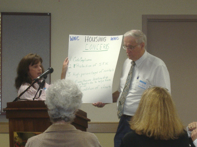 Debbie Campbell and County Councilman David MacLeod go through a list of problems with housing in Wicomico County.