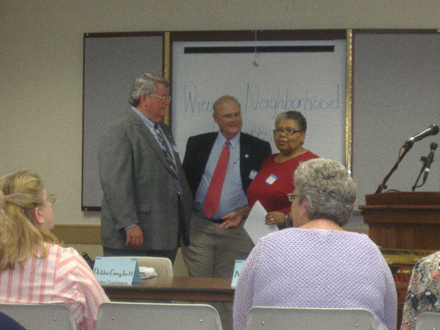Salisbury City Councilwoman Shanie Shields (right) discusses the issues with Rick Pollitt (left) and Rocky Burnett (center).